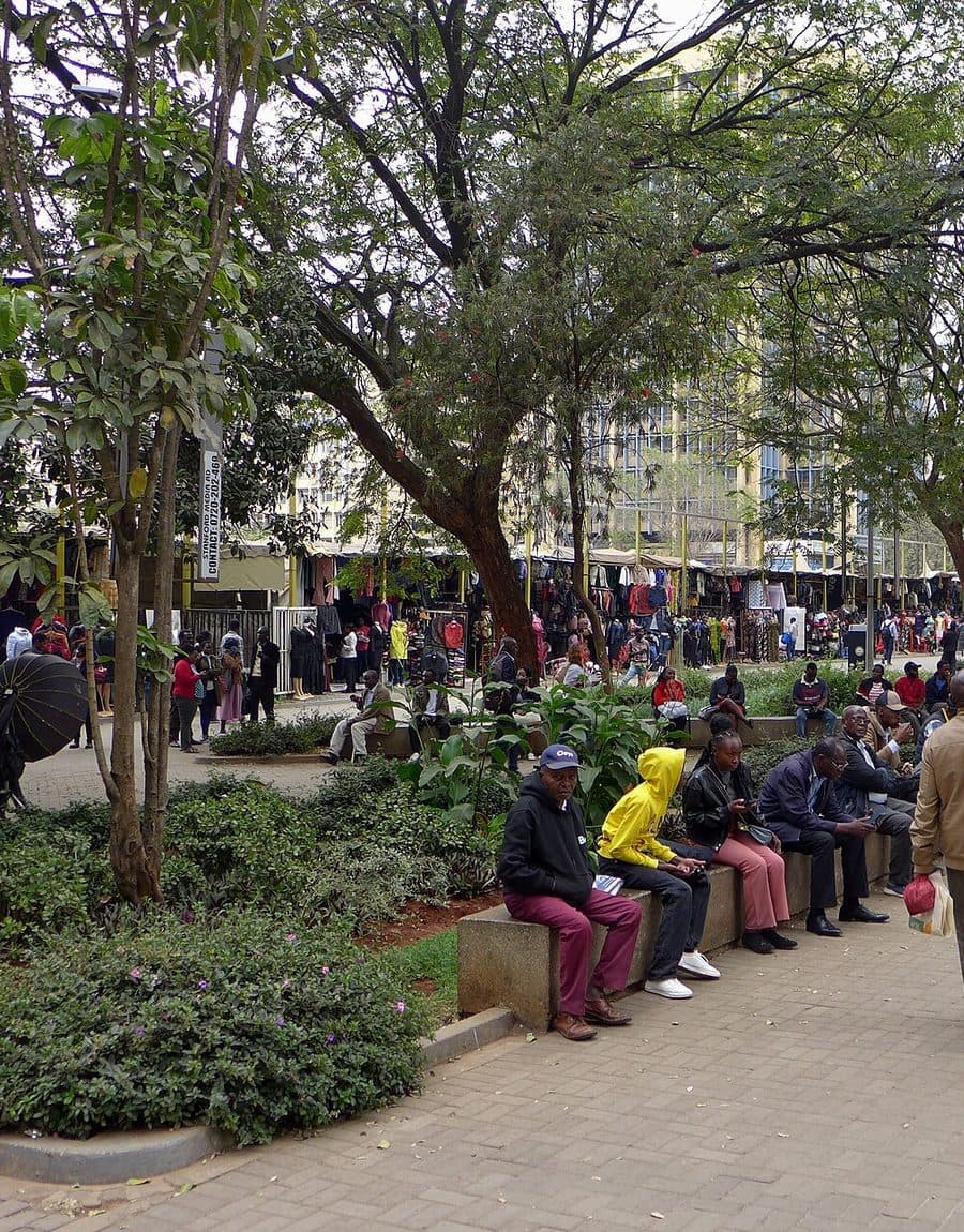 Traders and clothing stalls lining a busy street in central Nairobi